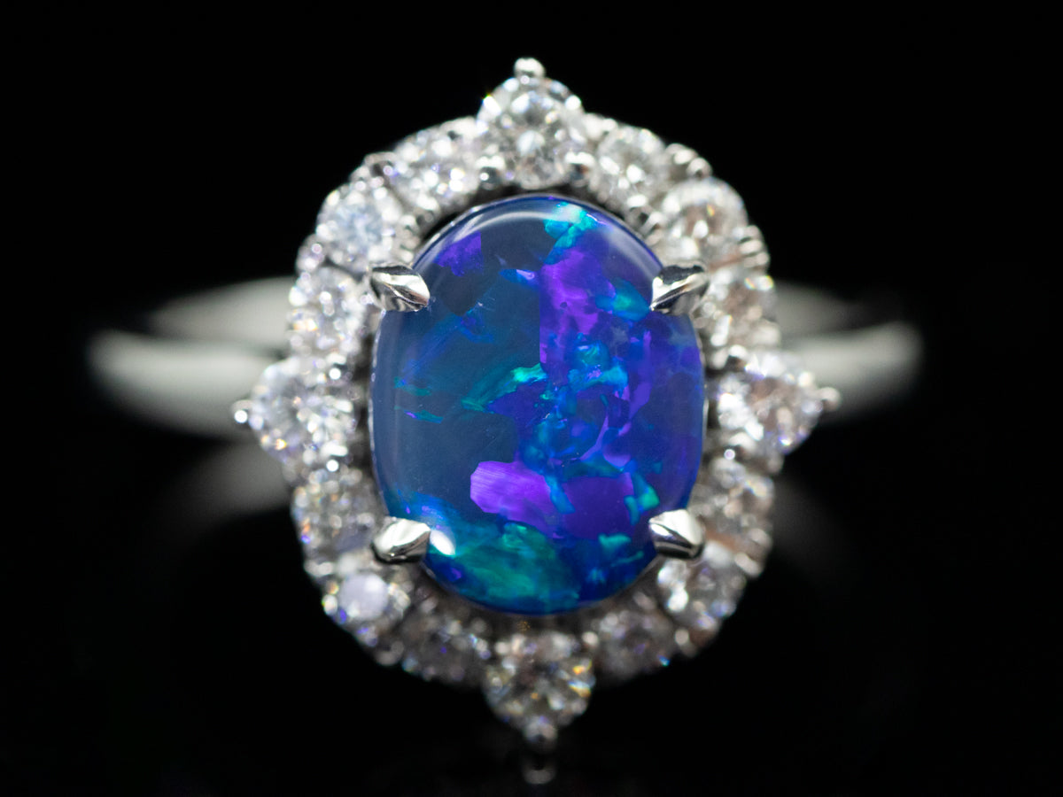 18K White Gold Black Opal Oval and Diamond Halo Ring