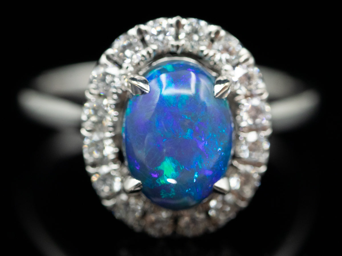 18K White Gold Black Opal Oval and Diamond Halo Ring