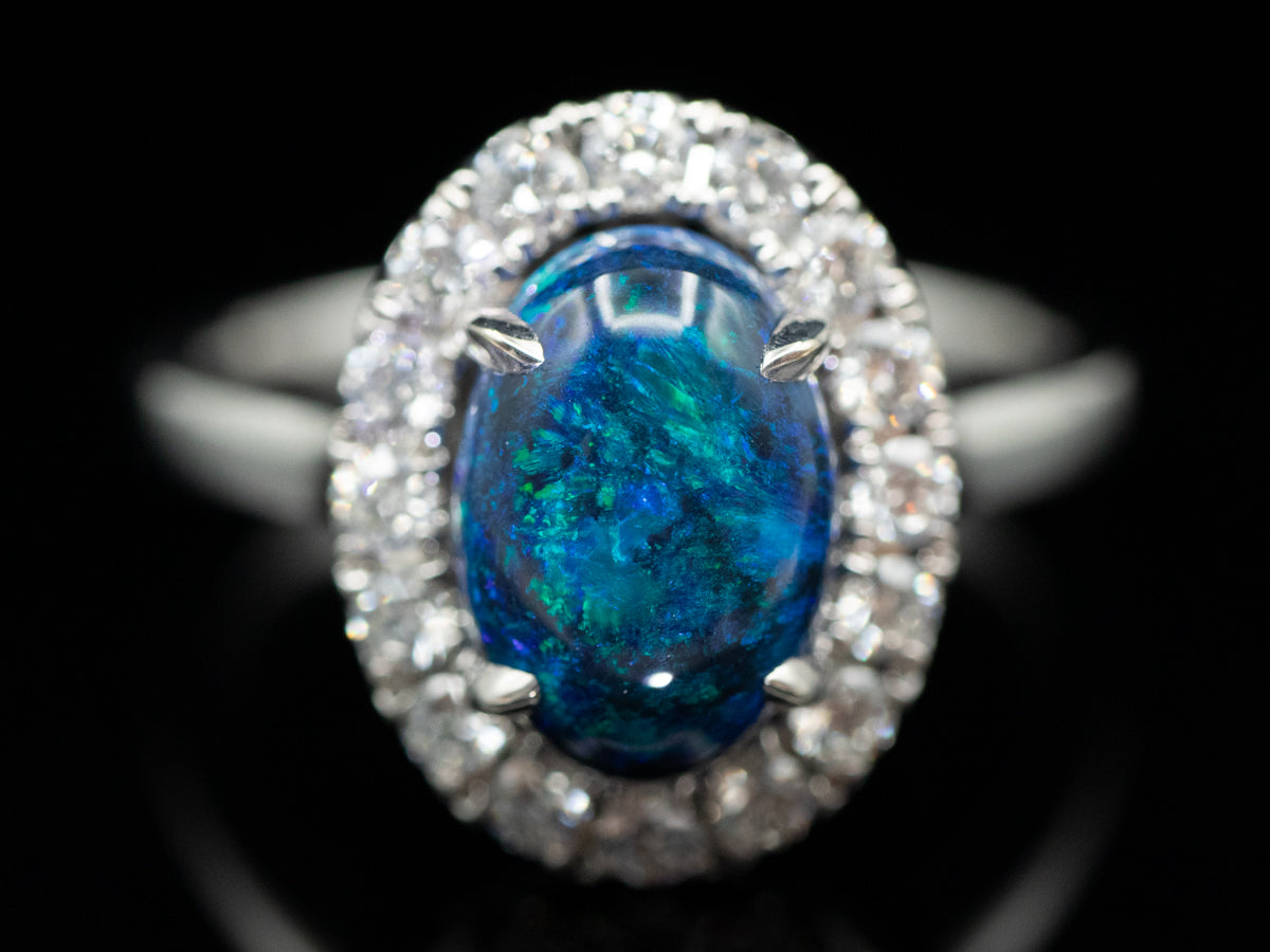 18K White Gold Black Opal Oval and Diamond Halo Ring