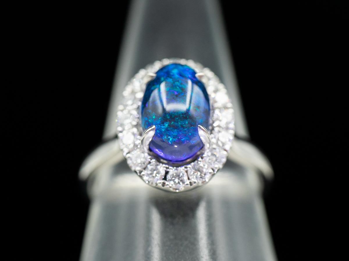 18K White Gold Black Opal Oval and Diamond Halo Ring