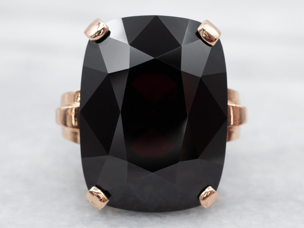 Sleek Rose Gold Garnet Solitaire Cocktail Ring