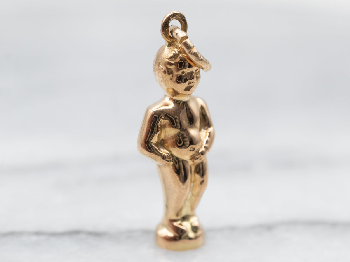 Dije dorado de la estatua del Manneken Pis