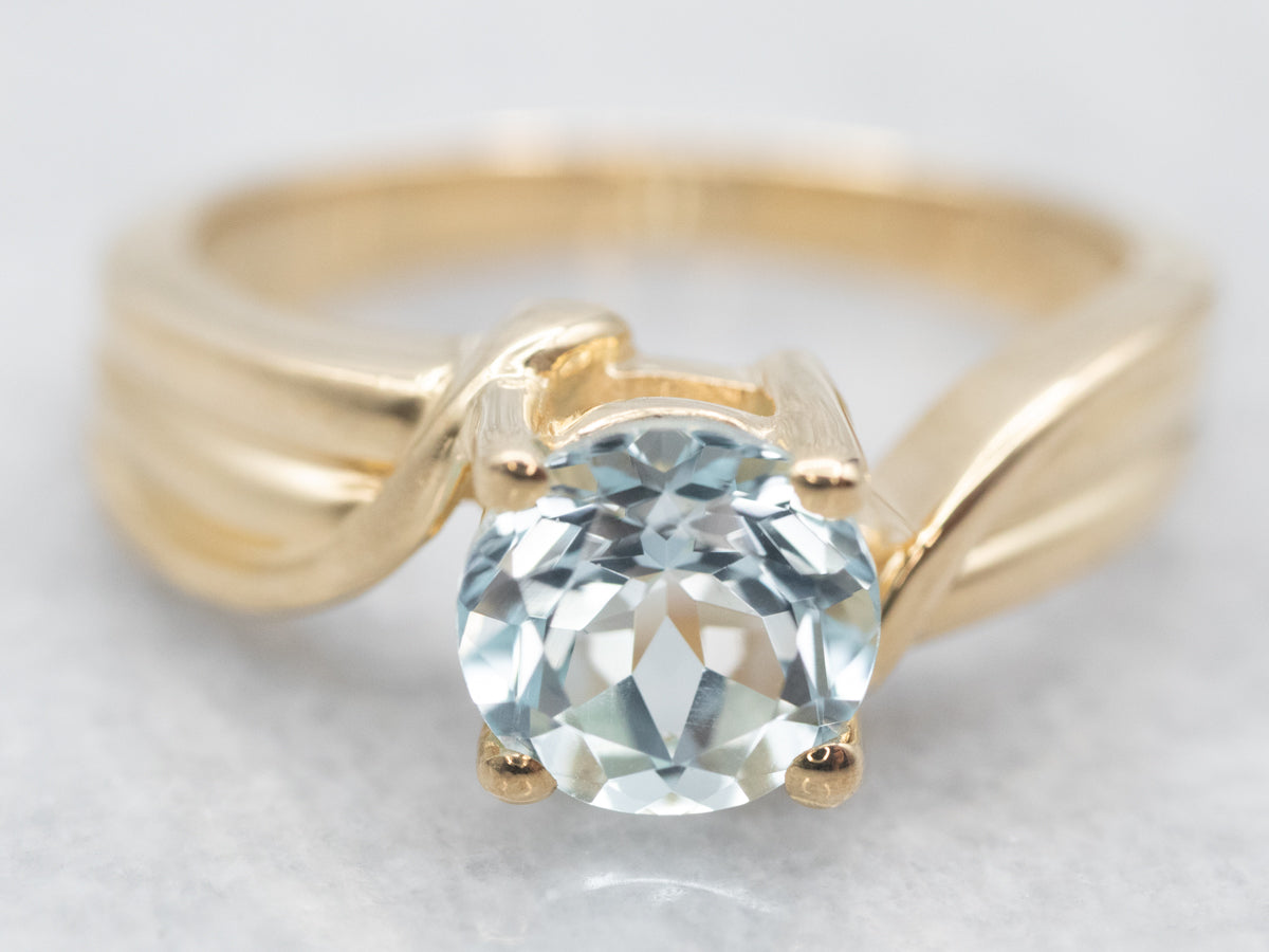 Polished Gold Blue Topaz Solitaire Bypass Ring