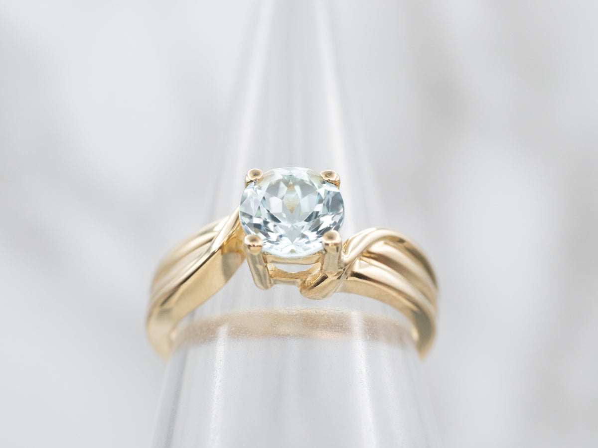 Polished Gold Blue Topaz Solitaire Bypass Ring