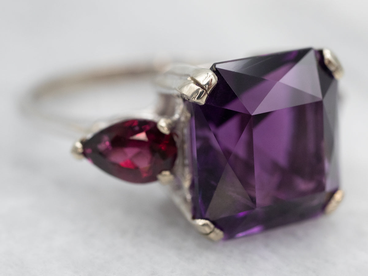 Expertly Crafted White Gold Amethyst Cocktail Ring with Garnet Accents