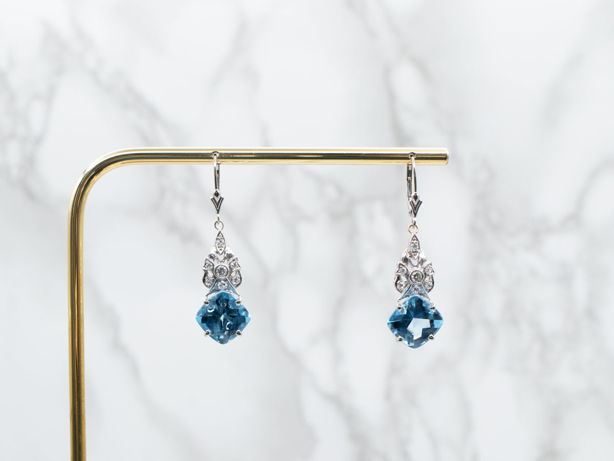 Pendientes colgantes de topacio azul y diamantes