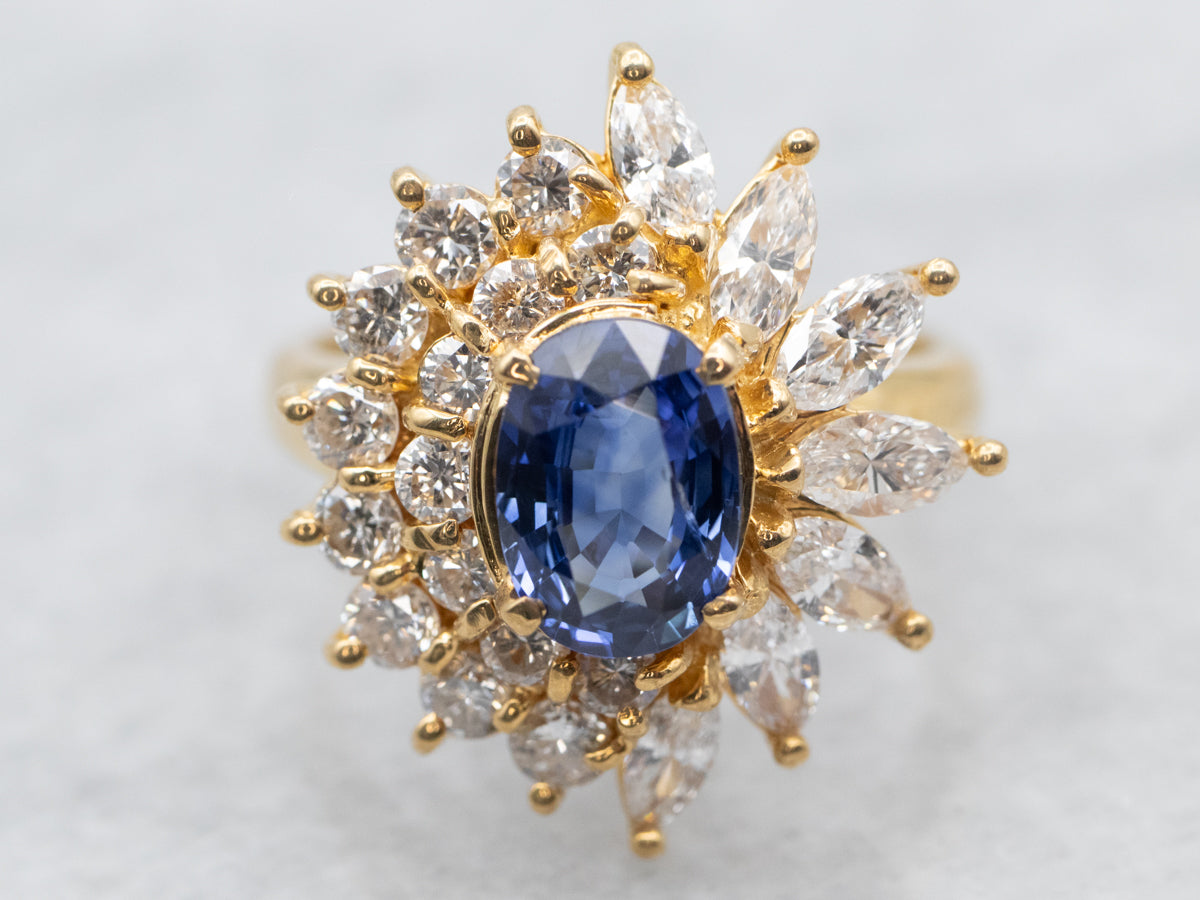 Yellow Gold Oval Cut Sapphire Engagement Ring with Marquise and Round Cut Diamond Halo