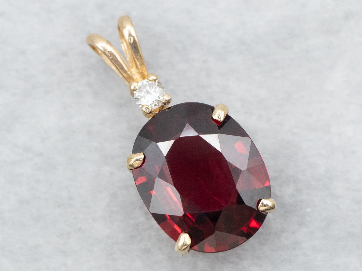 Oval Cut Garnet Pendant with Diamond Accent