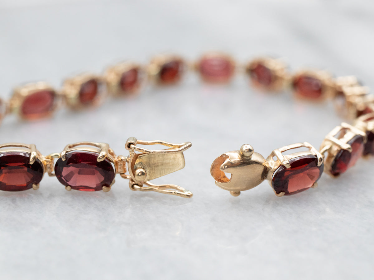 Yellow Gold Oval Cut Garnet Tennis Bracelet