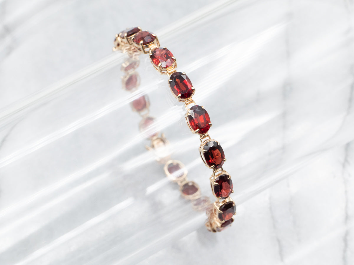 Yellow Gold Oval Cut Garnet Tennis Bracelet