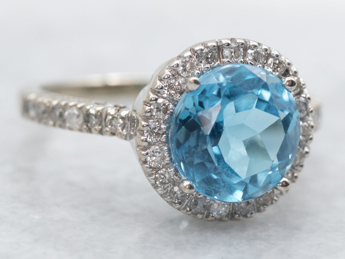 Modern White Gold Blue Topaz and Diamond Halo Ring