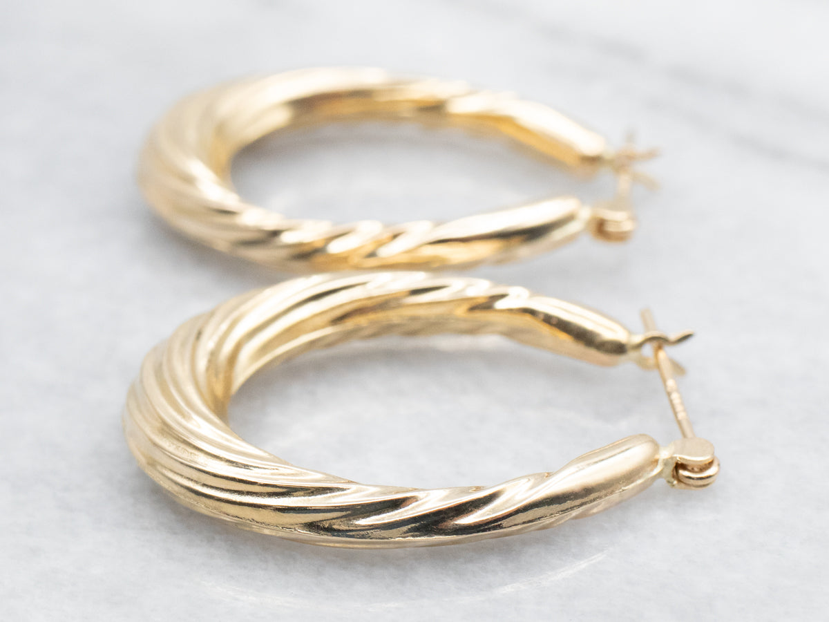 Hollow Oval Twist Hoop Earrings