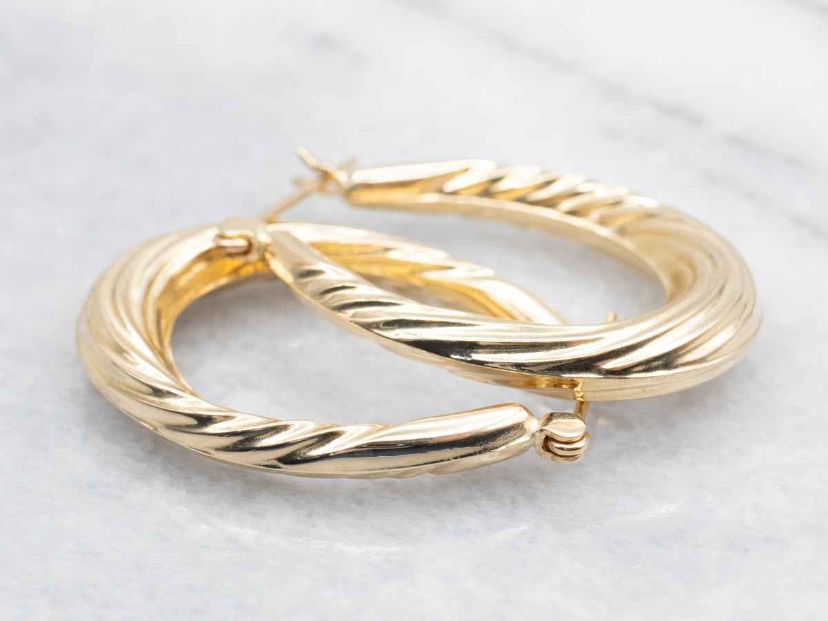 Hollow Oval Twist Hoop Earrings