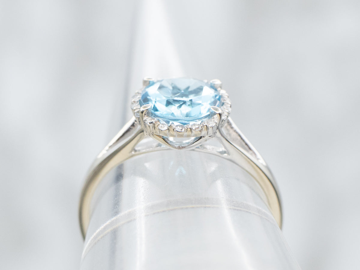 Modern Blue Topaz Ring with Diamond Halo