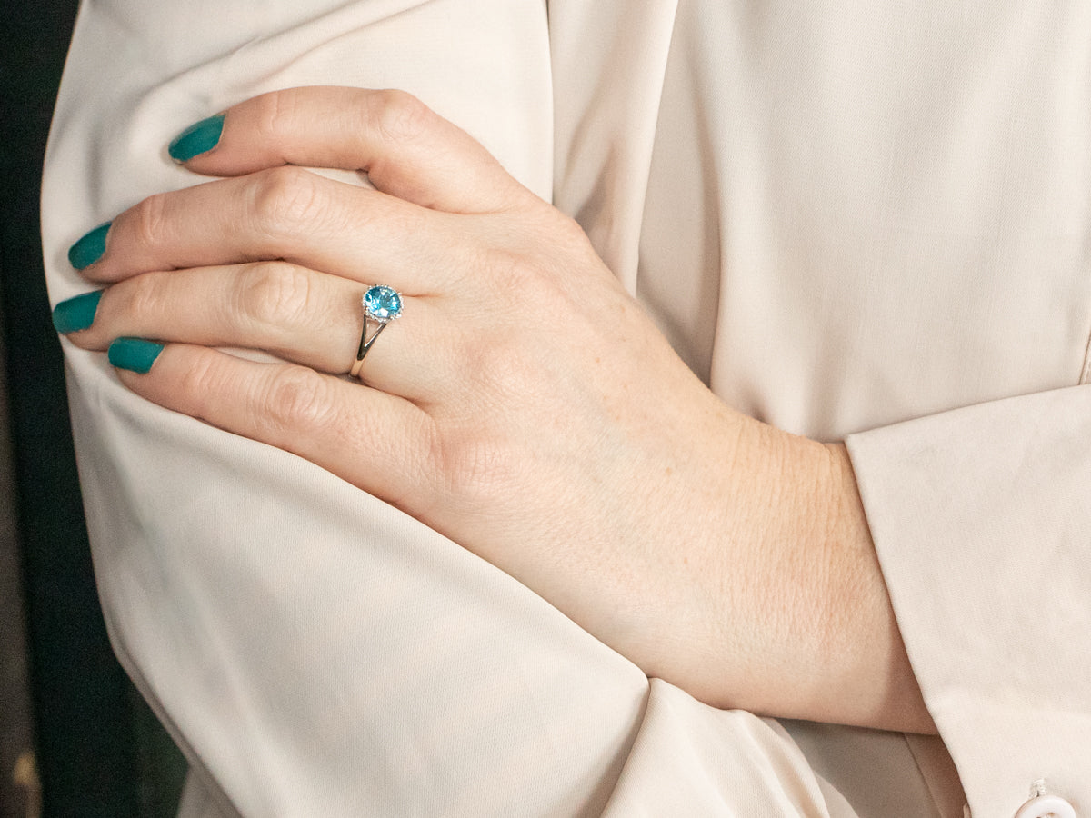 Modern Blue Topaz Ring with Diamond Halo