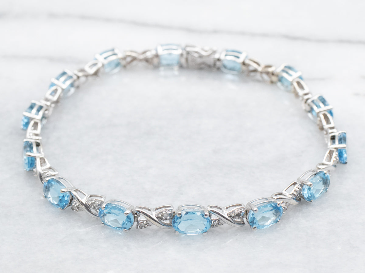 White Gold Blue Topaz X Link Tennis Bracelet with Diamond Accents