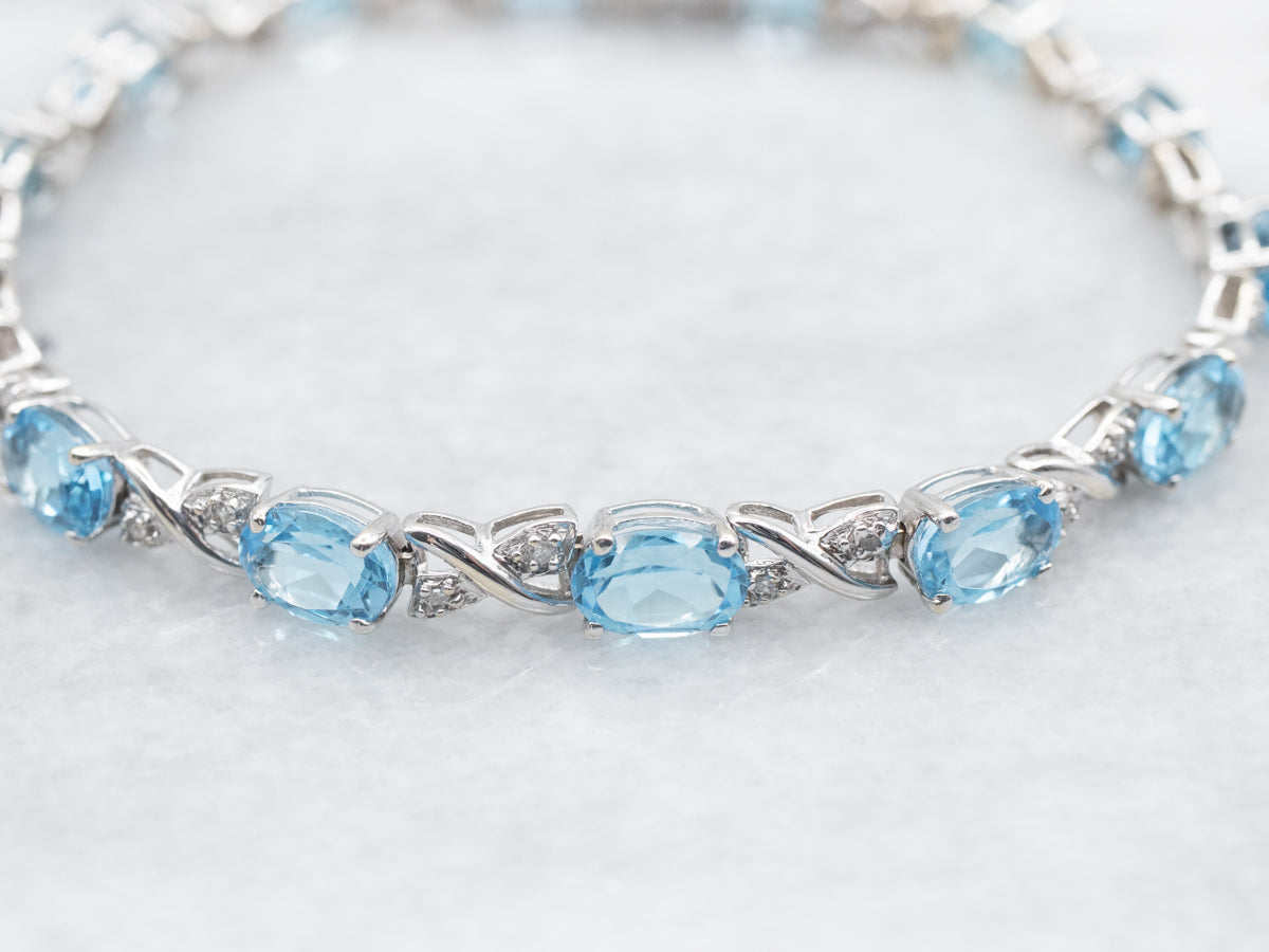 White Gold Blue Topaz X Link Tennis Bracelet with Diamond Accents