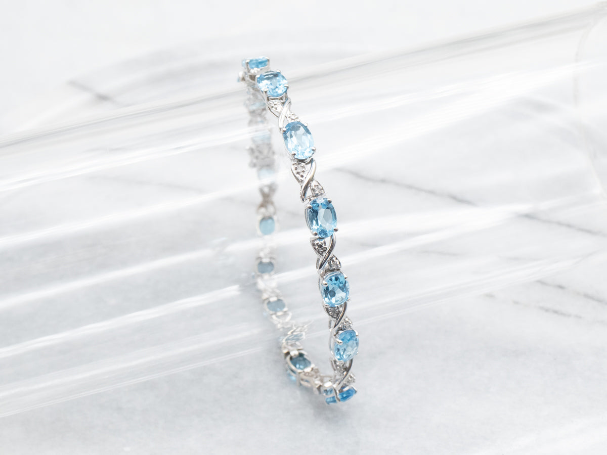 White Gold Blue Topaz X Link Tennis Bracelet with Diamond Accents