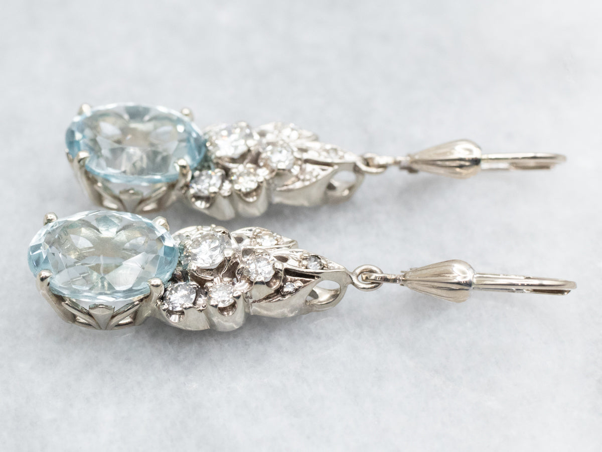 Pendientes colgantes de topacio azul y diamantes