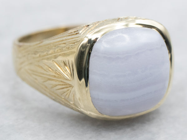 This Ring is a size 11 and has a 13 x 18mm Crazy Lace agate set in a bold gallery bezel, and has an eagle top on both sides.