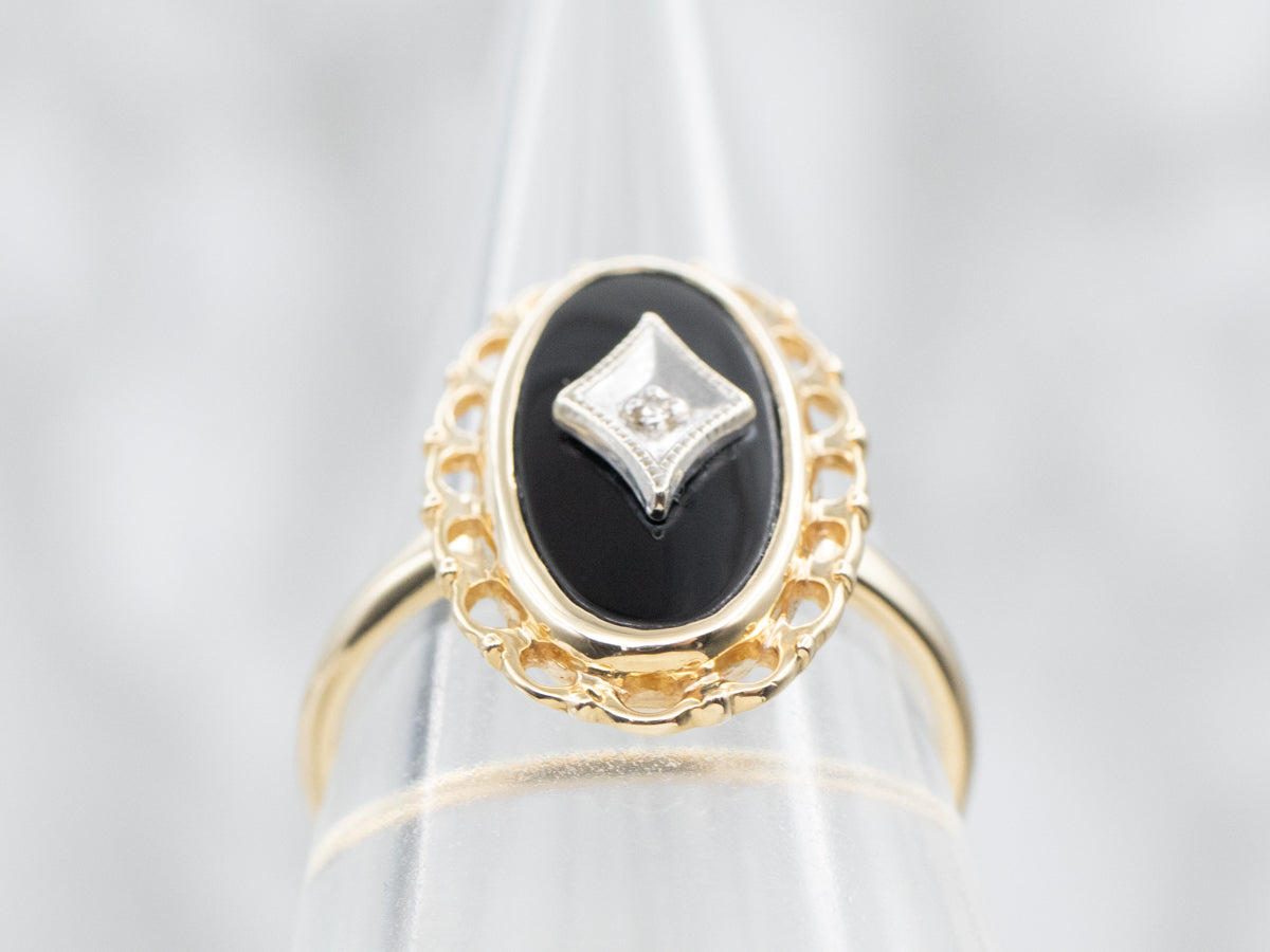 Woman’s onyx ring 2024 with diamonds in center.