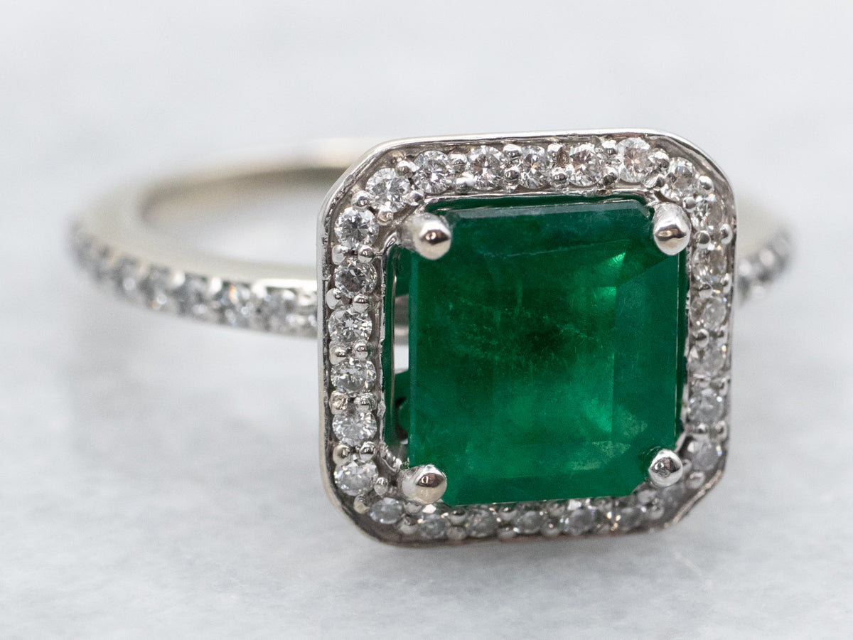 Modern Emerald and Diamond Halo Engagement Ring