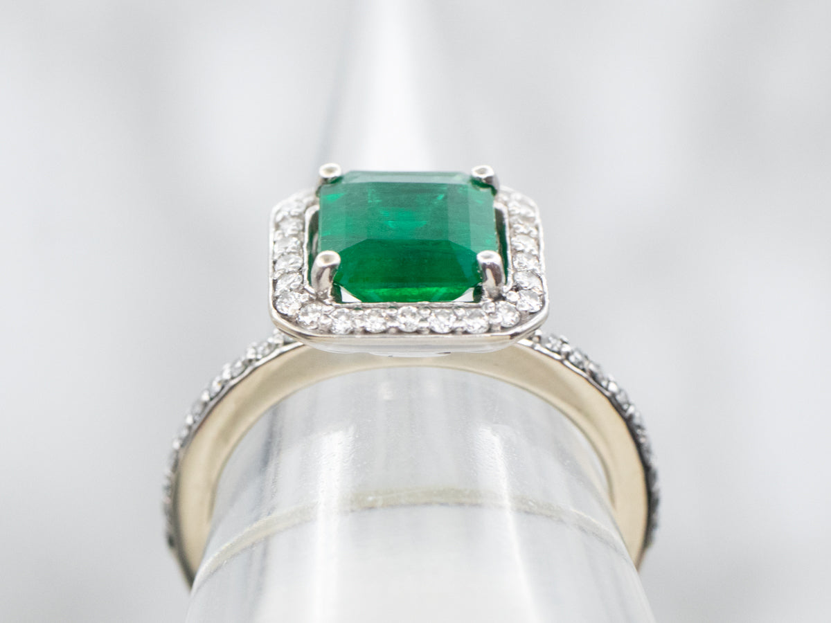 Modern Emerald and Diamond Halo Engagement Ring