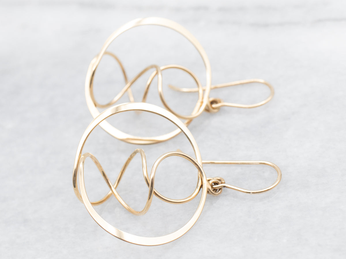 Twisting Polished Gold Circle Drop Earrings