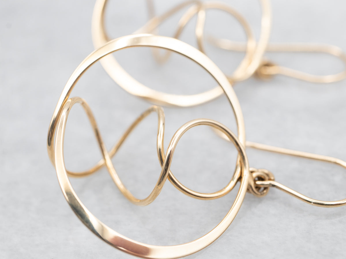 Twisting Polished Gold Circle Drop Earrings