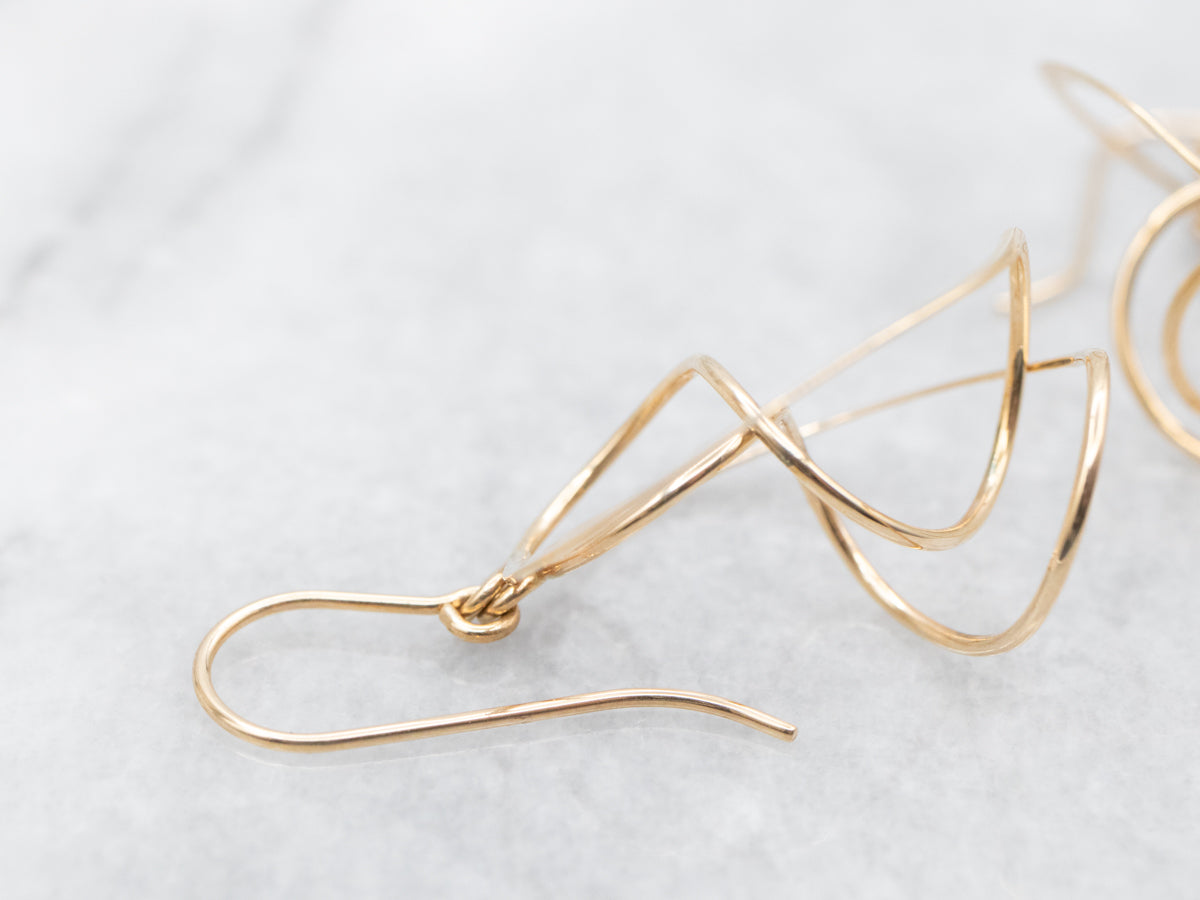 Twisting Polished Gold Circle Drop Earrings