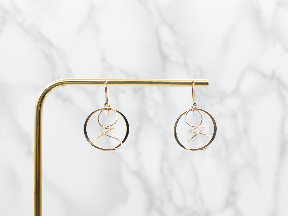 Twisting Polished Gold Circle Drop Earrings