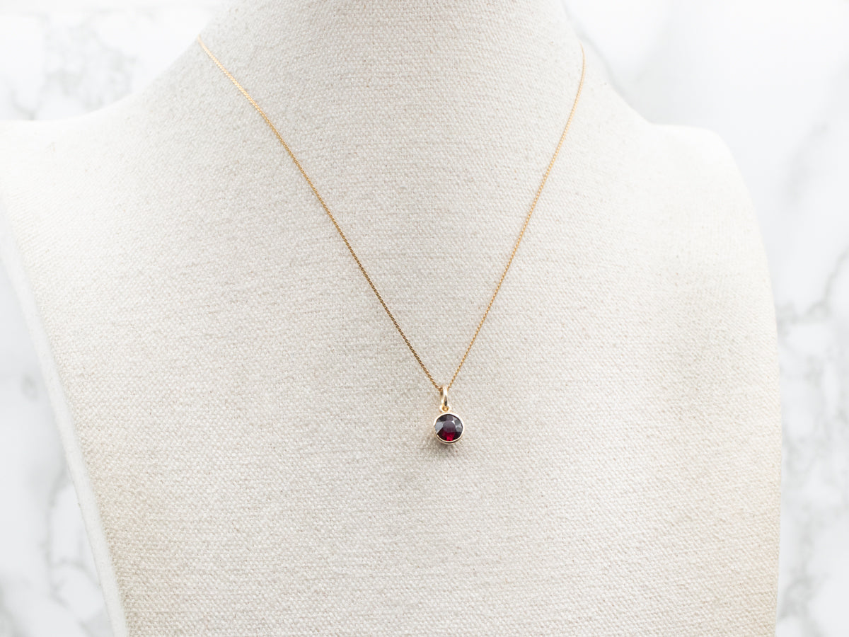 Gold Bezel Set Round Garnet Solitaire Pendant