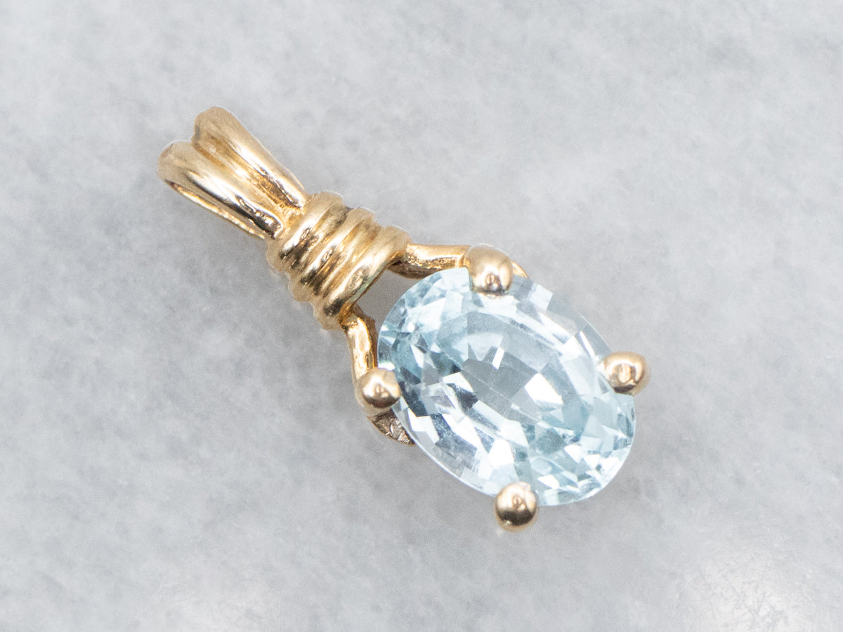 Blue Topaz Solitaire Pendant in Yellow Gold