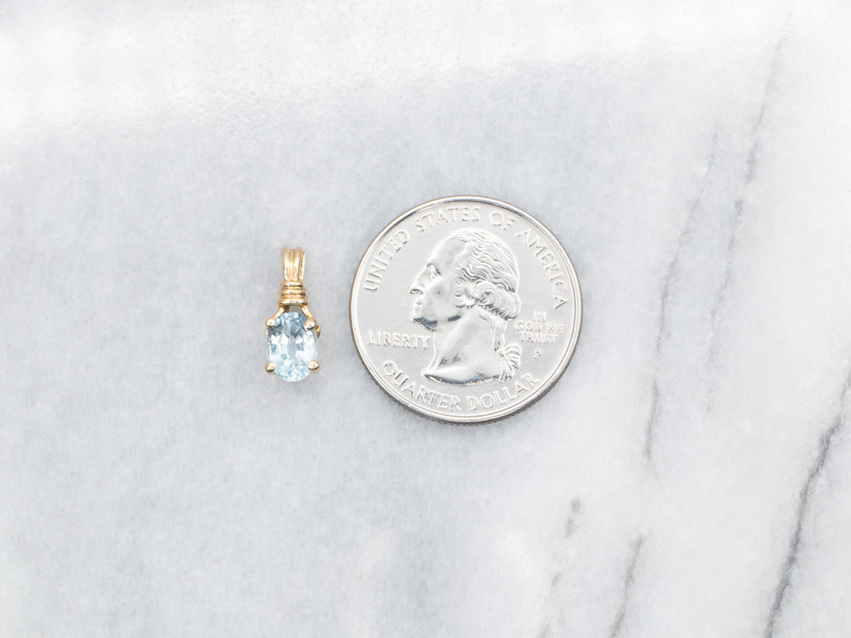 Blue Topaz Solitaire Pendant in Yellow Gold