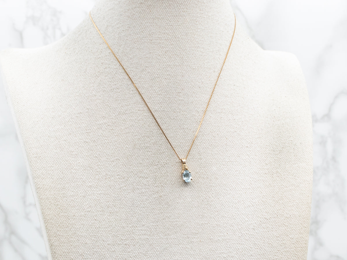 Blue Topaz Solitaire Pendant in Yellow Gold