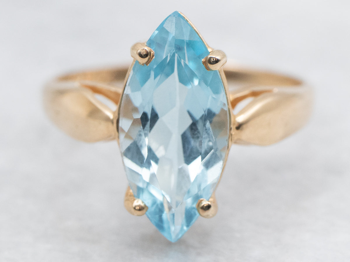 Marquise Blue Topaz Solitaire Ring in Yellow Gold Setting