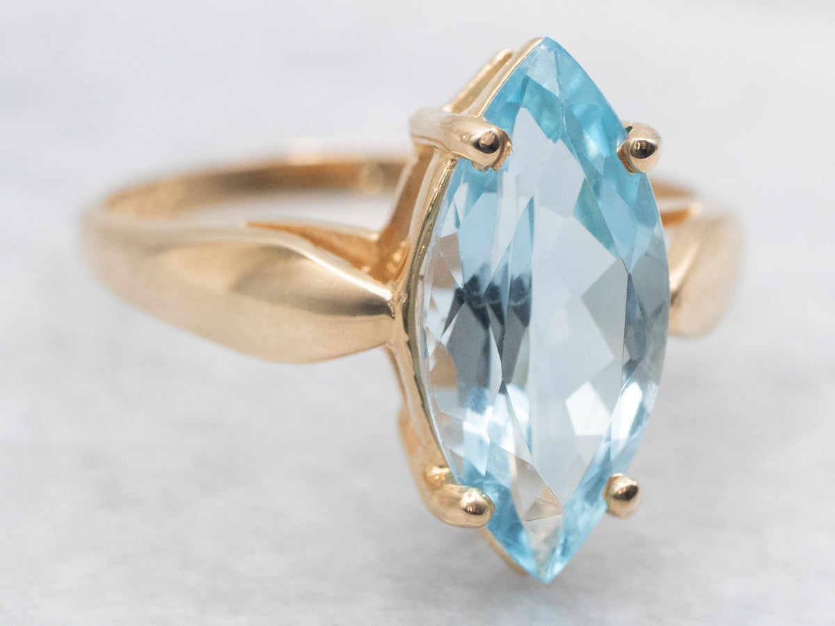 Marquise Blue Topaz Solitaire Ring in Yellow Gold Setting