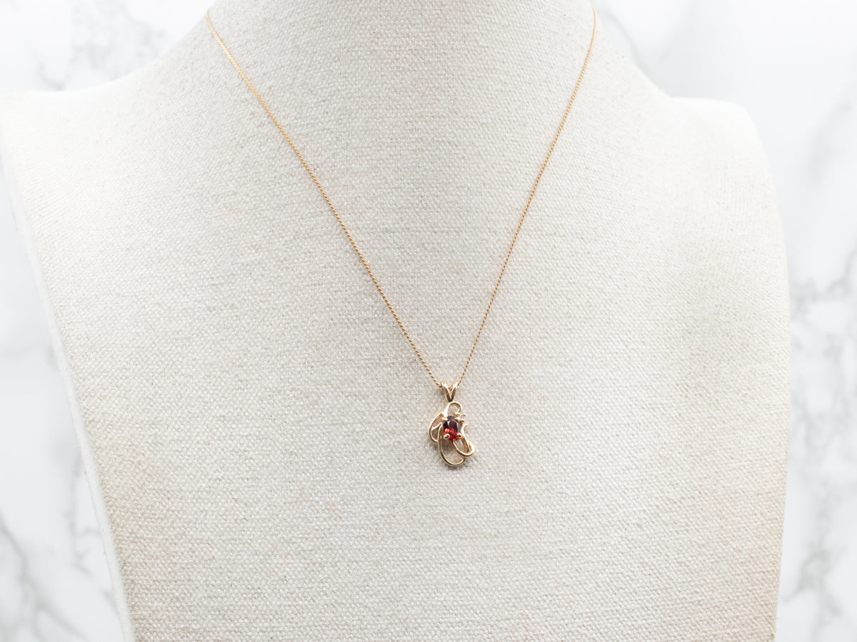 Scrolling Gold Garnet and Diamond Pendant