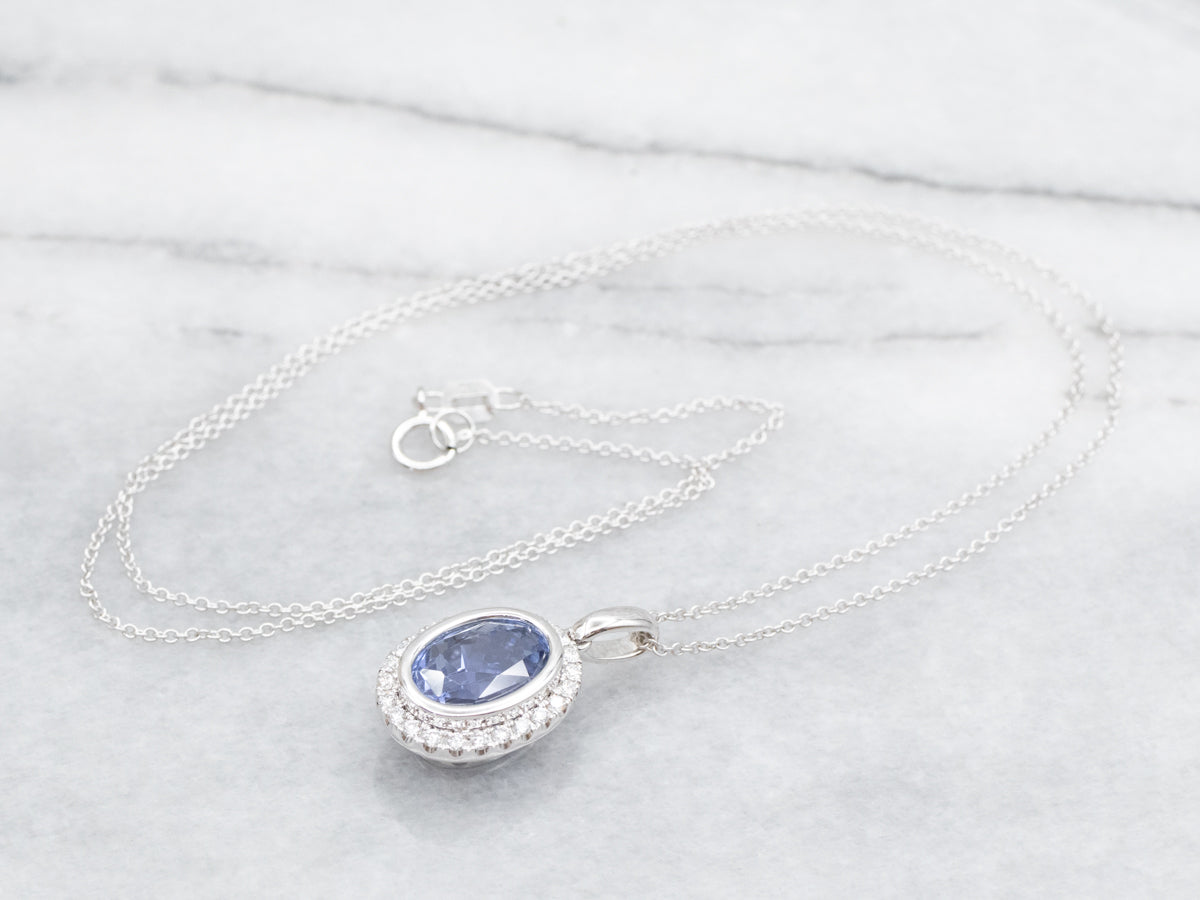 Bezel Set Sapphire Halo Pendant on Cable Chain