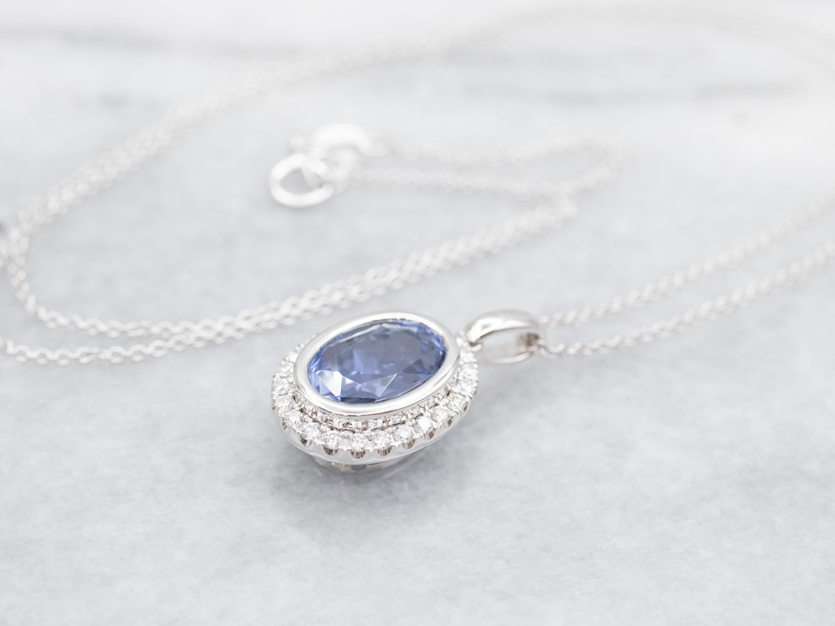 Bezel Set Sapphire Halo Pendant on Cable Chain