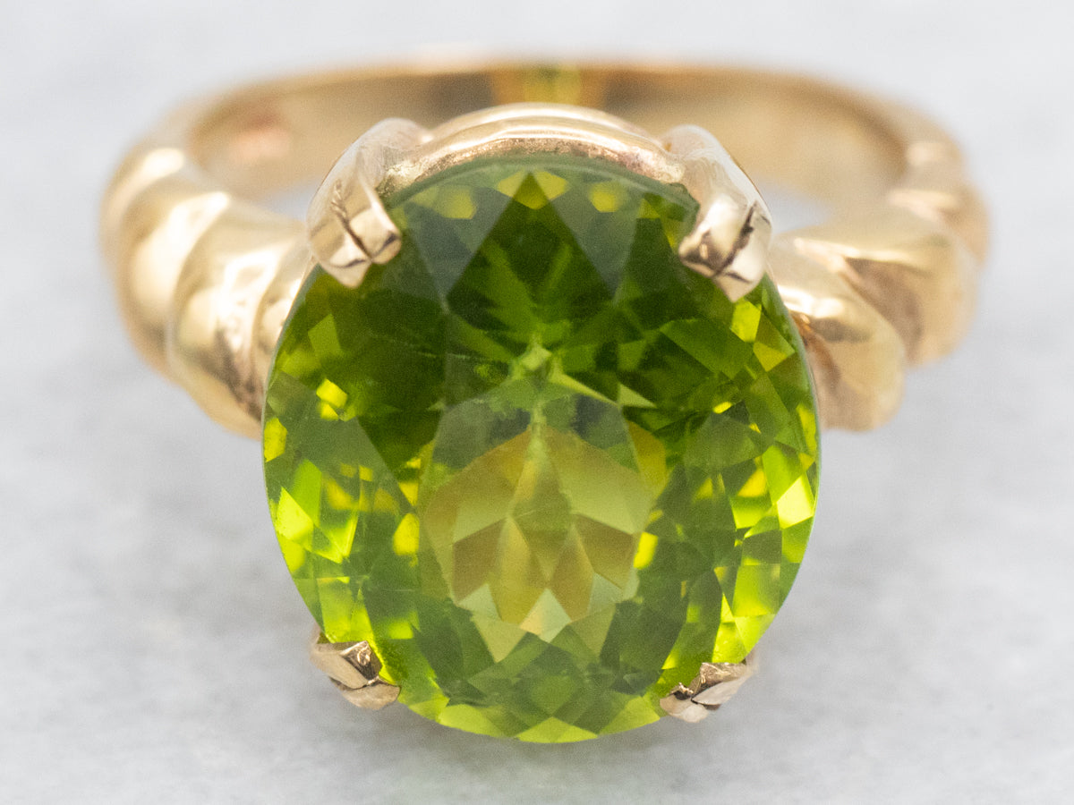 Bold Peridot and Curvaceous Gold Statement Ring