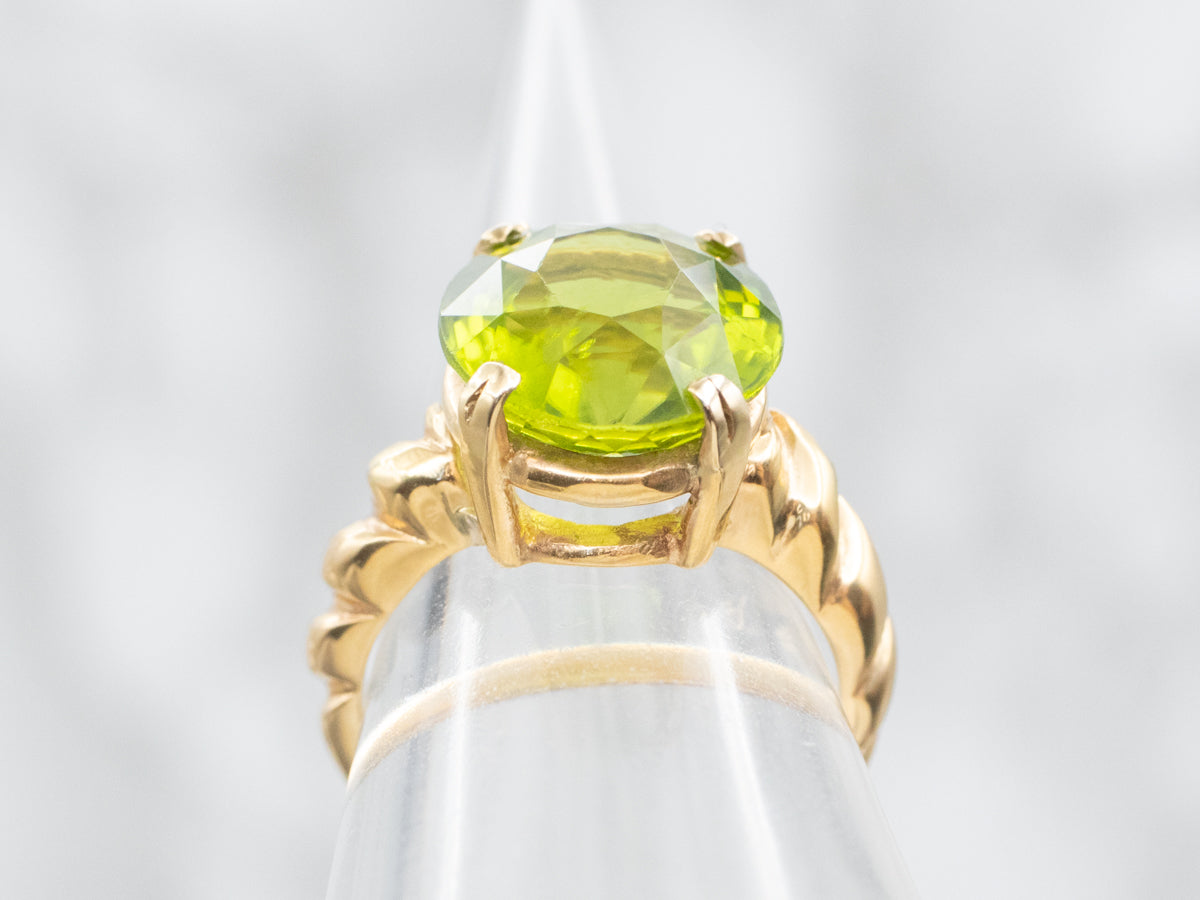 Bold Peridot and Curvaceous Gold Statement Ring