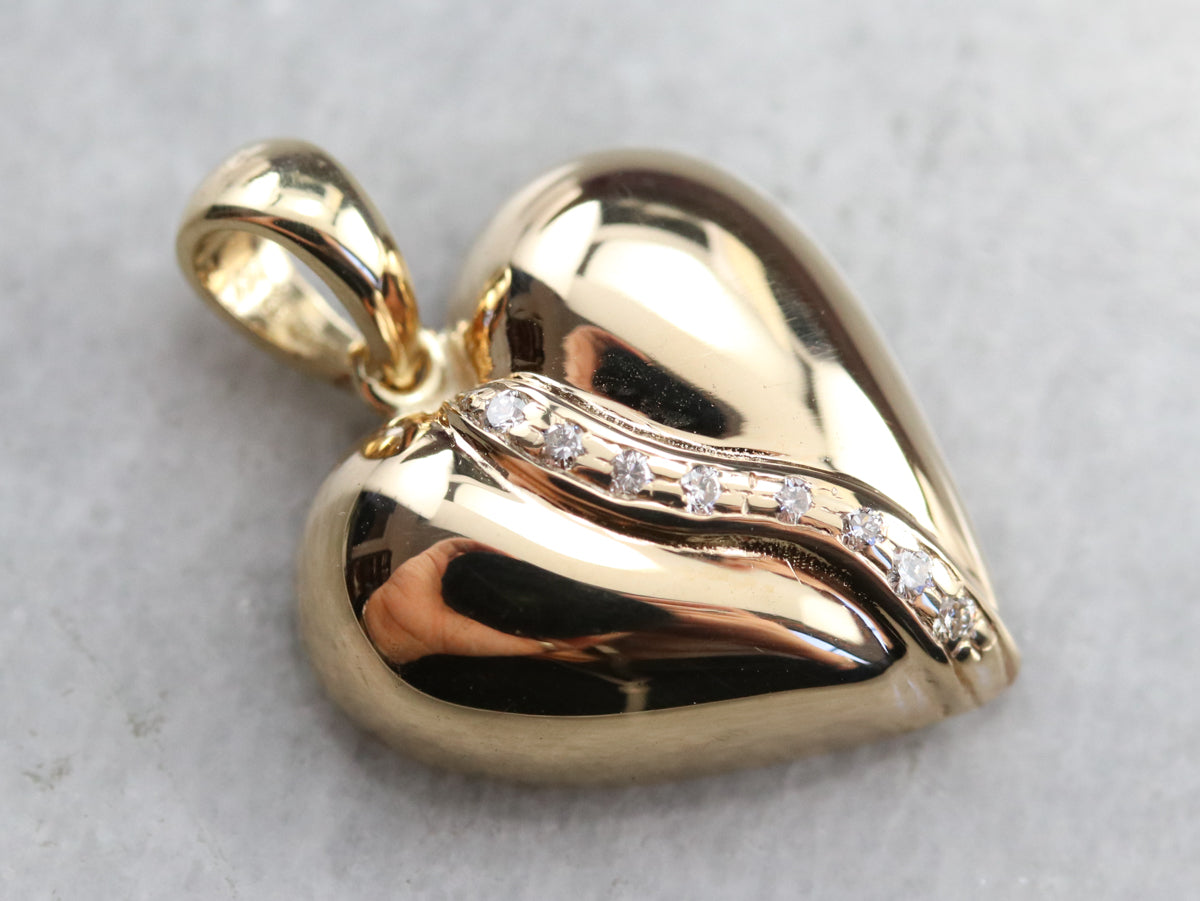 Colgante de oro con corazón de diamantes