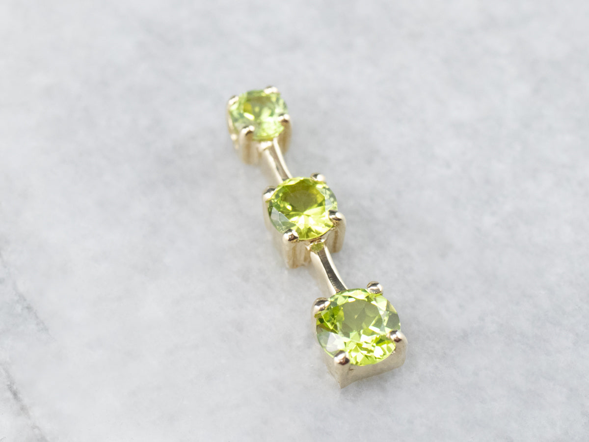 Graduated Three Stone Peridot Gold Pendant