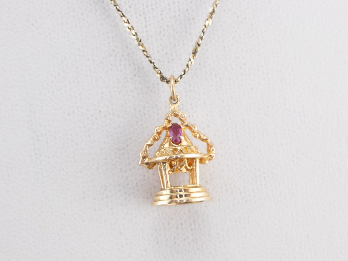 Ornate Gold and Ruby Temple Charm