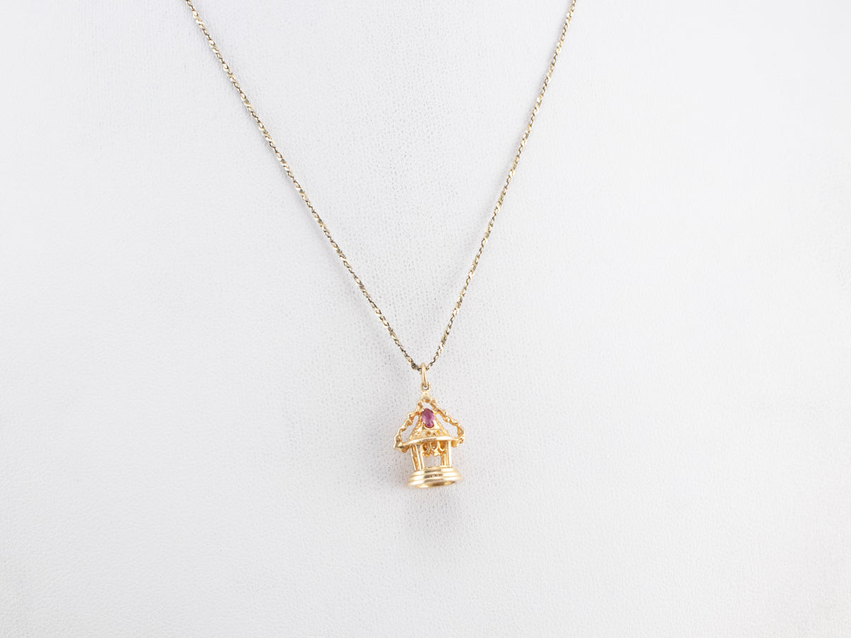 Ornate Gold and Ruby Temple Charm