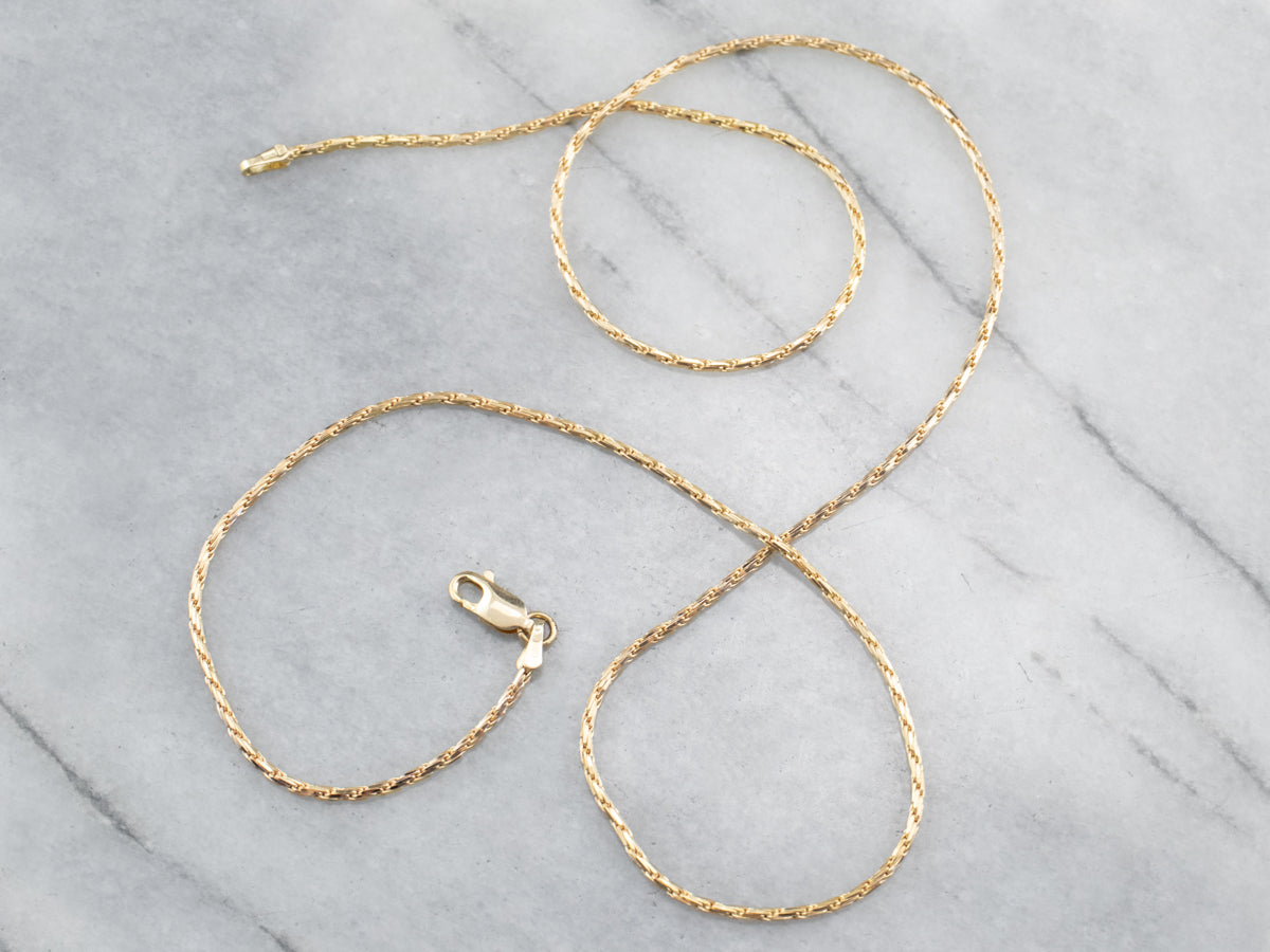 Twisted snake chain top