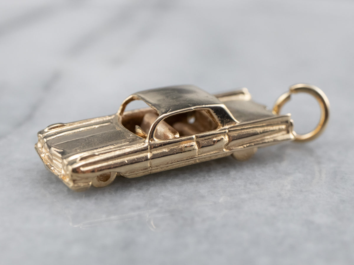 Gold cadillac store pendant