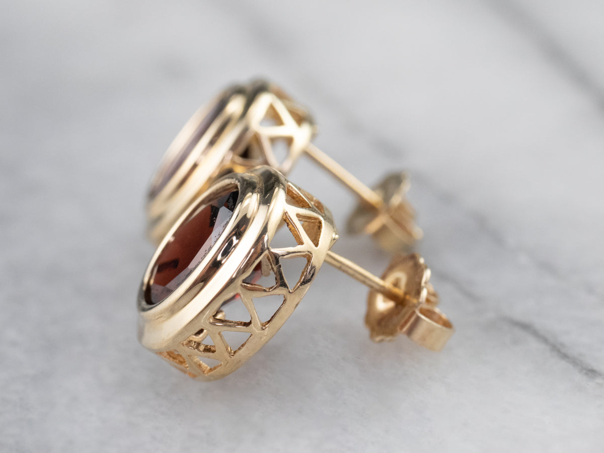 Bezel Set Garnet Stud Earrings in Yellow Gold