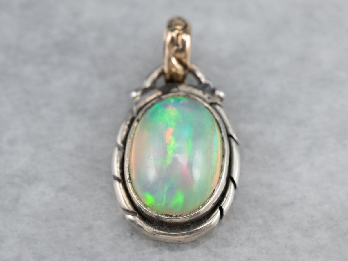 Sterling Silver, 10K Yellow Gold Ornate Bezel Set Opal Oval Solitaire Pendant